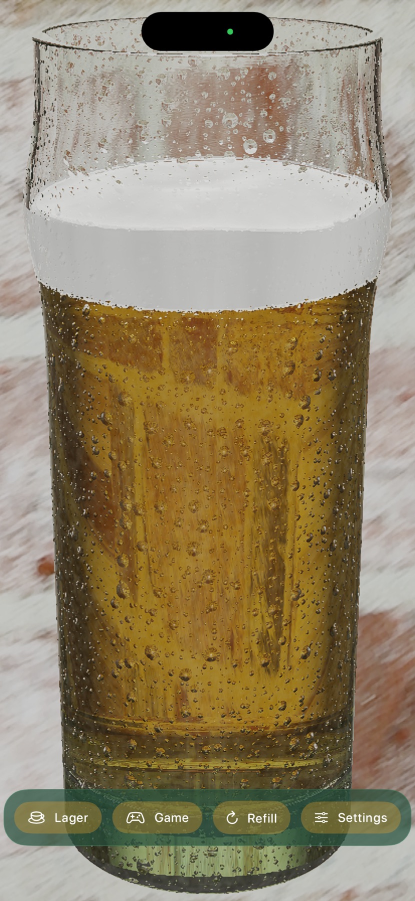 A full pint of lager on a wooden table, condensation beading on the glass