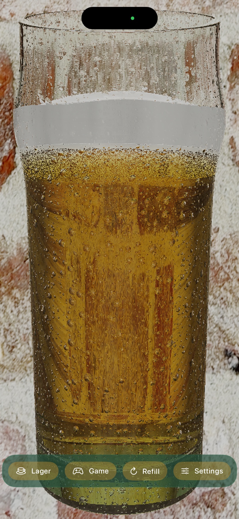 A lager glass tilted at a drinking angle, in front of a brick wall