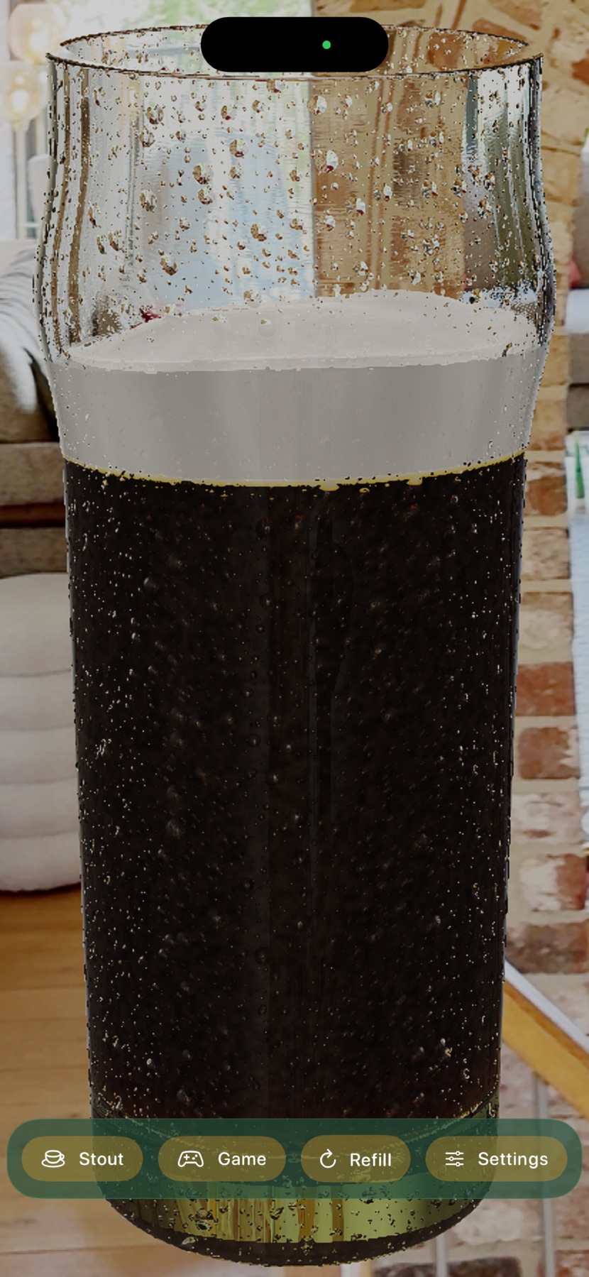 A full pint of stout, near-black with a pale head, in a living room