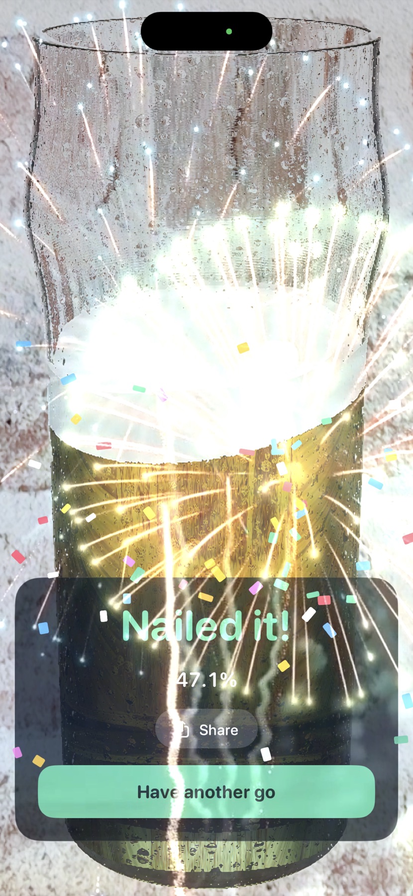 Split the Drinks result screen reading Nailed it, 47.1 percent, with confetti and fireworks over the glass
