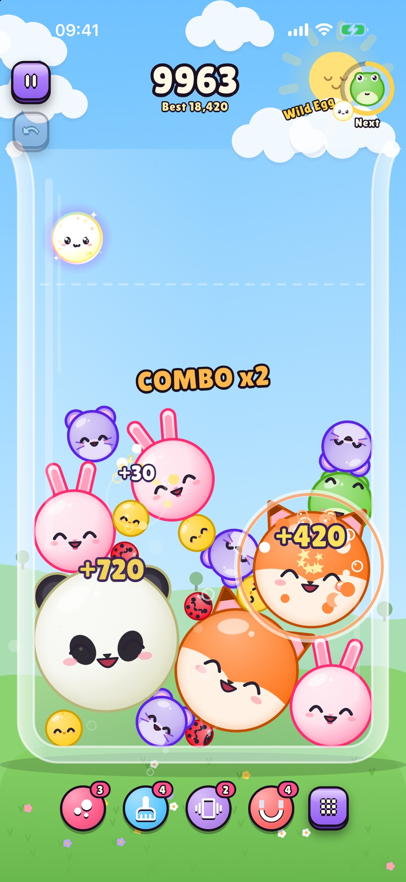 Gameplay in the glass jar: a pile of kawaii critters, a COMBO x2 banner, and points popping as critters merge